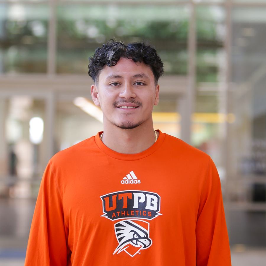 Portrait of Kelvin Huynh in a UTPB Athletics shirt.